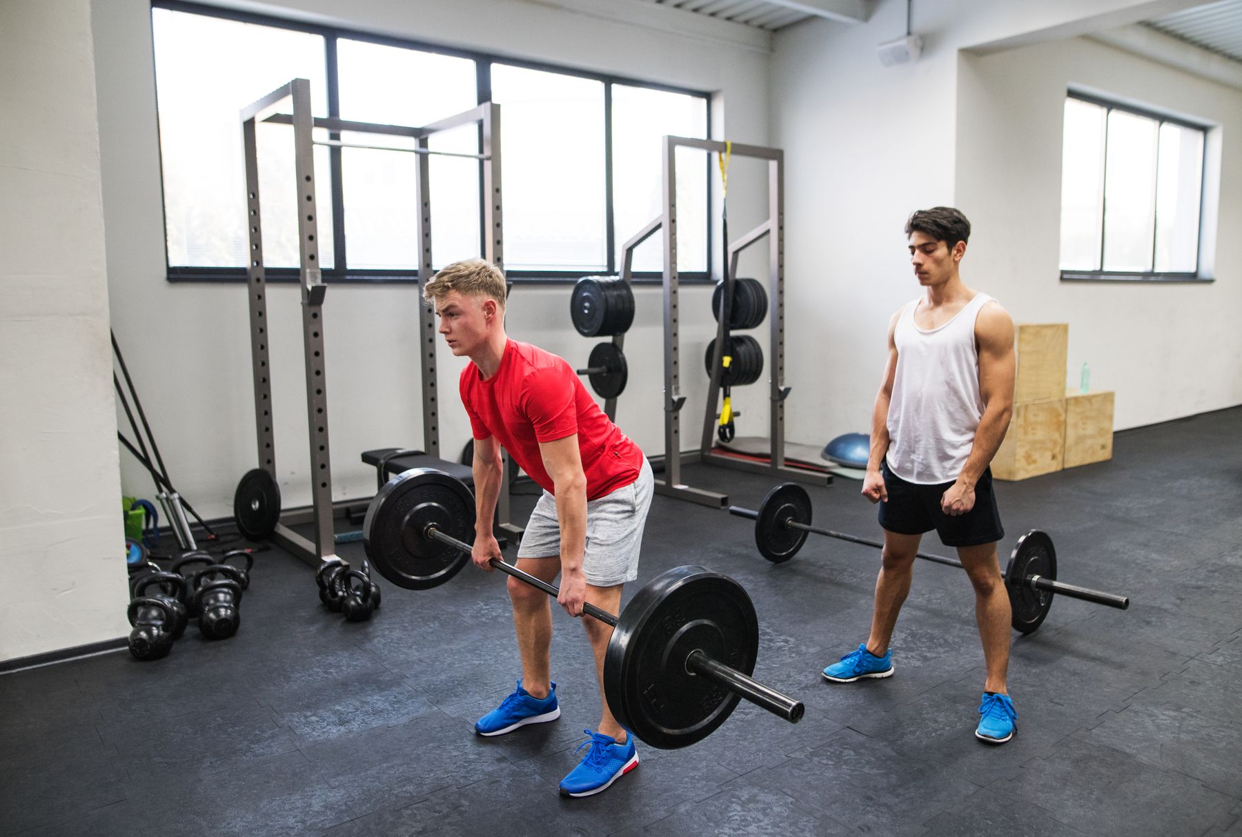 Teen athlete deadlifting in the weight room